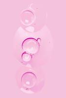 a pink background with many bubbles on it photo