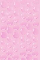 un rosado antecedentes con muchos burbujas en eso foto
