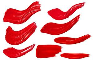 red paint strokes set on white background photo