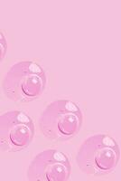 a pink background with many bubbles on it photo