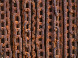 rusty metal texture with chain as a background photo