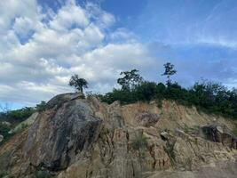 landscape of rocky mountain blue sky and clouds evening at narathiwat province thailand. photo