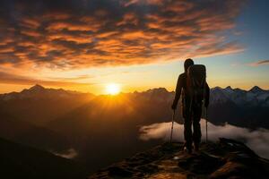 Hiker on the top of the mountain looking at the beautiful landscape sunset Ai Generated photo