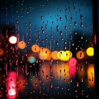 Abstract night scene window with colorful raindrops, blurred city lights For Social Media Post Size AI Generated photo