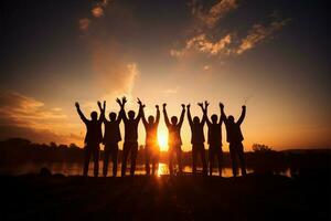 Joyful unity Silhouettes of a team joining hands in the air AI Generated photo