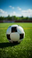 un fútbol pelota en contra un pintoresco fútbol campo antecedentes vertical móvil fondo de pantalla ai generado foto