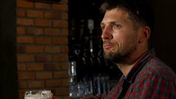 Mature man toasting with his beer to the camera video