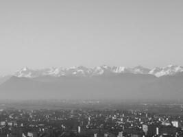 Aerial view of Turin with Alps mountains in black and white photo