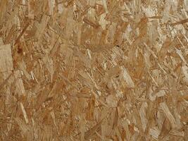 brown oriented strand board wood texture background photo