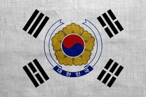 bandera y Saco de brazos de república de Corea en un texturizado antecedentes. concepto collage. foto