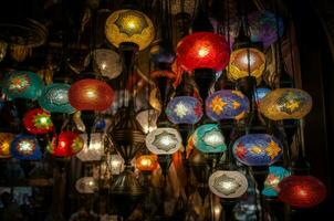 Multicolored hanging lanterns glowing. Generate ai photo