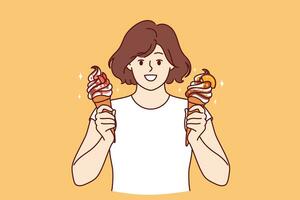 Teenage woman holds two ice creams with fruit syrup and waffle cone and looks at screen smiling photo