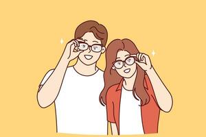 Man and woman in eyeglasses to improve and correct vision, stand in casual clothes photo