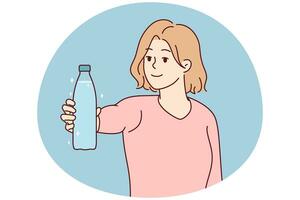 Smiling woman holding bottle of water photo