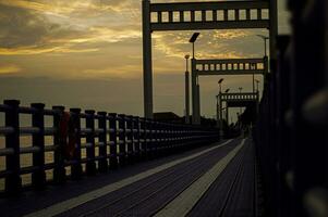 Evening sky on the bridge in the garden photo