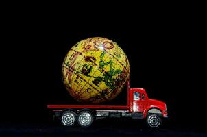 a toy truck with a globe on top photo