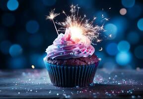 Birthday cupcake with a candle and festive tinsel decoration on a blue background with copy space ai generative photo