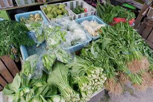 various types of vegetables on display and sold in traditional markets photo