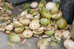 A pile of green coconut shells can be used as charcoal photo