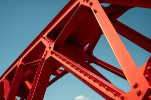 bajo ángulo de un metal rojo estructura debajo el claro azul cielo, ai generativo foto