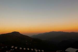 Sunset-colored landscape background the mountain from north of Thailand photo