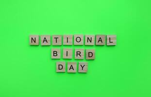 January 5, National Bird Day, minimalistic banner with the inscription in wooden letters photo