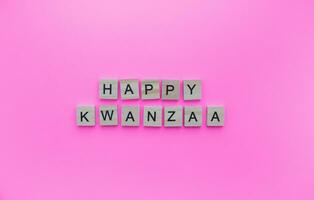 December 26 - January 1, Kwanzaa, minimalistic banner with the inscription in wooden letters photo