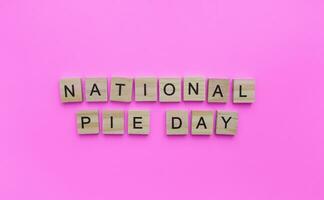 January 23, National Pie day, minimalistic banner with the inscription in wooden letters photo