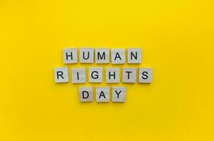 December 10, Human Rights Day, minimalistic banner with the inscription in wooden letters photo