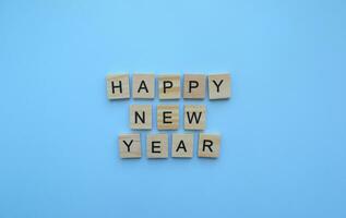 January 1, New Year, minimalistic banner with the inscription in wooden letters photo