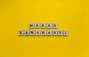 January 13, Kite Festival in India, Makara Sankranti, minimalistic banner with wooden letters photo