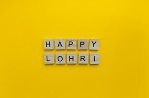 January 13, Lohri, minimalistic banner with the inscription in wooden letters photo