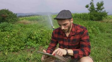 Farmer using tablet. video