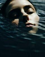 Minimalistic photography captures the peacefulness of a woman submerged in water with her eyes closed.. Generative AI photo