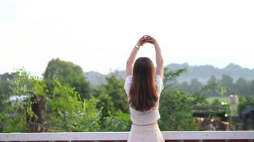 Female tourists stretch their bodies to take in the bright atmosphere. video