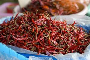 dried chilies in basket are herbal plants, a flavoring in processed foods derived from fresh chilies. Spicy taste Popularly used as an ingredient in curry paste or dried into chili powder. photo