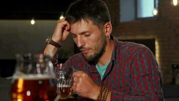 Depressed man drinking alone at the bar video