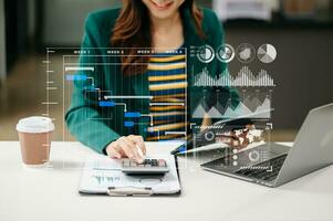 Businessman hand Project manager working and update tasks and Gantt chart scheduling virtual diagram.with smart phone, tablet and laptop photo