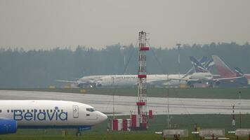 MOSCOW, RUSSIAN FEDERATION JULY 30, 2021 - Passenger aircraft Boeing 73786N, EW526PA of Belavia on the taxiway at Sheremetyevo airport, side view. Background, airport airfield, traffic video