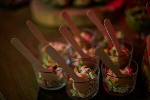 Buffet at the party. quick snacks on the buffet table. Dishes with chopped meat and vegetables. photo