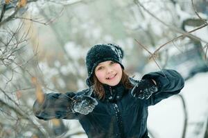 A girl shows a class holding her thumbs up. photo