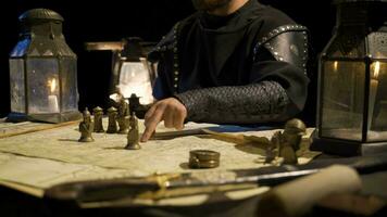 Making war plans in ancient times. By candlelight. Historical scenes. video