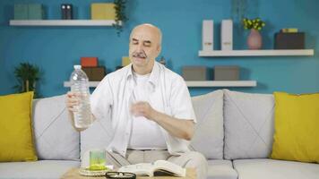 The sick man drinks a lot of water. video