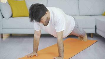 Man doing push-ups at home. video