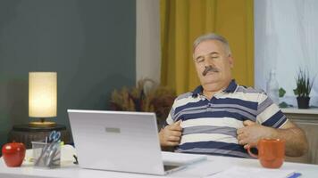 Home office worker man looking smugly at camera. video