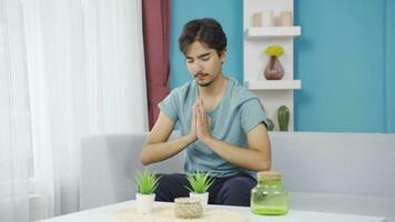 Christian man praying in front of the window. video