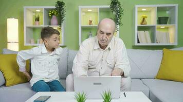 The boy gives a gift to his grandfather. Surprise. video