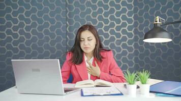 Young business woman experiencing shortness of breath. video