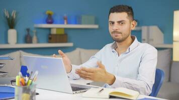 Home office worker man says shhh to camera. video