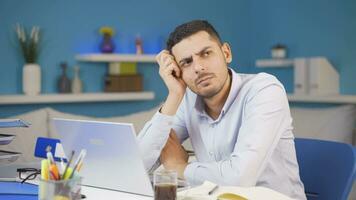 Home office worker man coming up with idea looking at camera. video